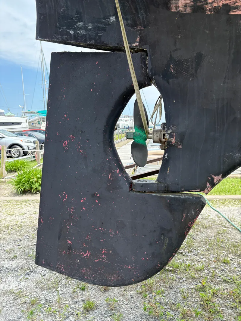 Slide: The Image of Rudder of 1978 Cheoy Lee Off Shore 41 sailboat, showing wear and propeller. - 4