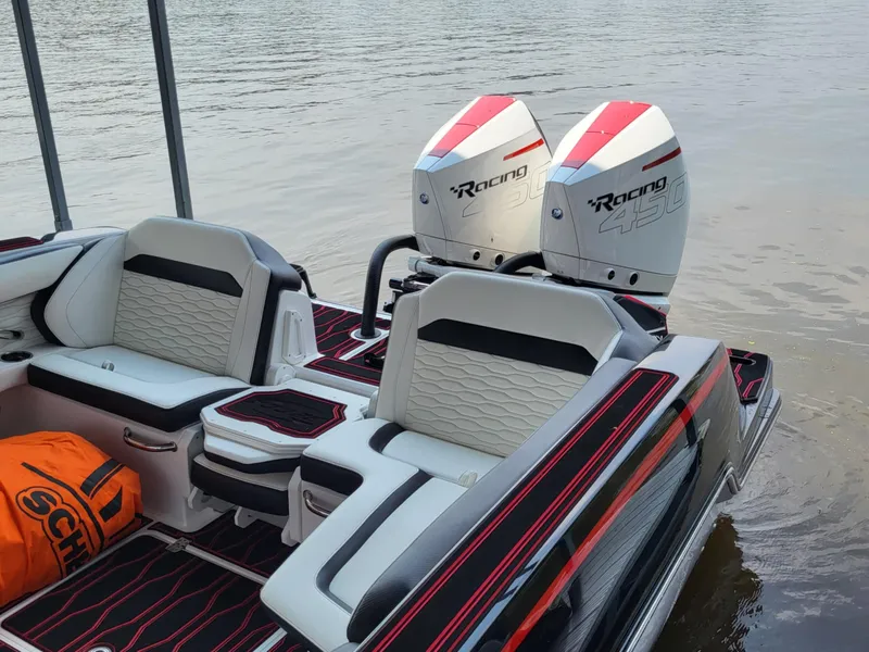 Slide: The Image of 2023 Sunsation 32 CCX boat with dual Racing 450 engines on water. - 11