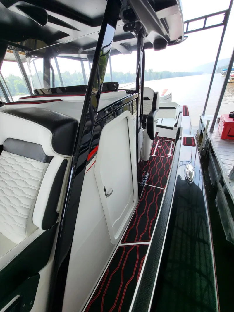 Slide: The Image of 2023 Sunsation 32 CCX boat interior with sleek seating and modern design. - 16