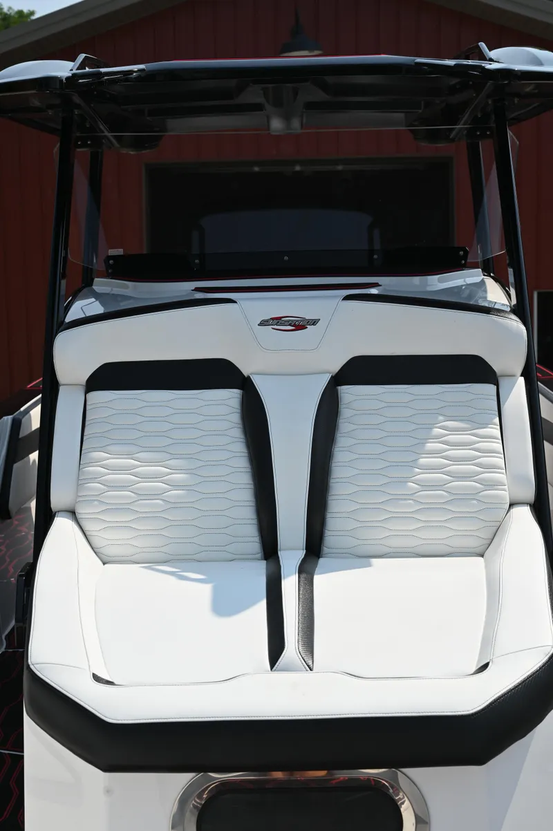 Slide: The Image of 2023 Sunsation 32 CCX boat with sleek white and black seating design. - 19