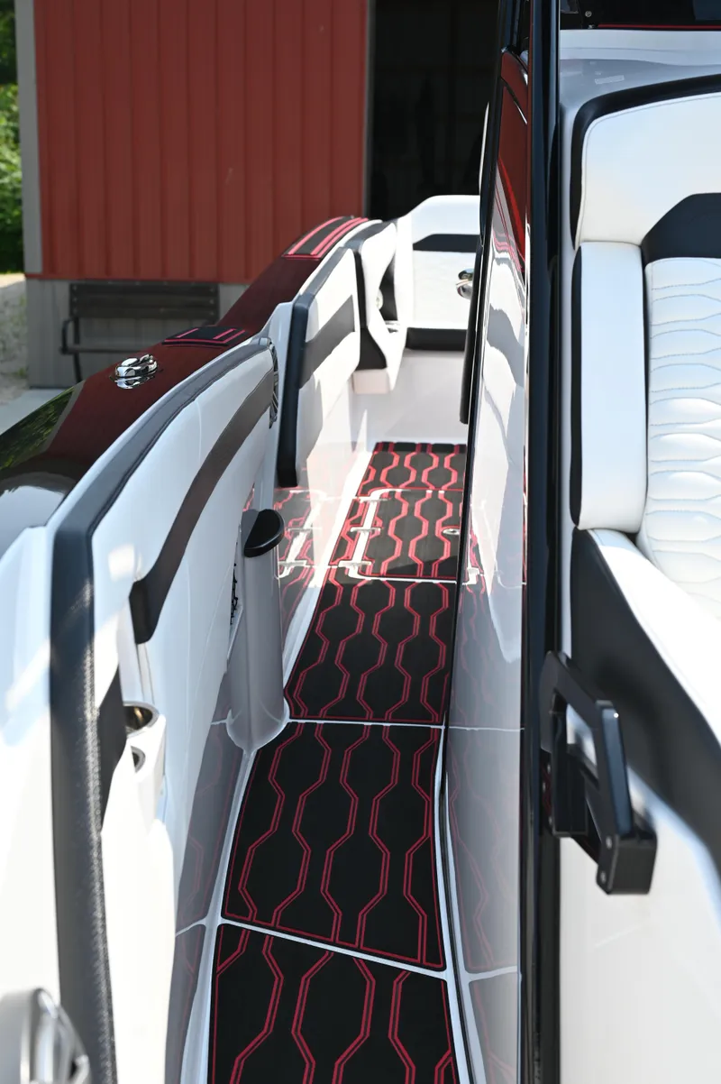 Slide: The Image of 2023 Sunsation 32 CCX boat interior with stylish black and red flooring. - 20