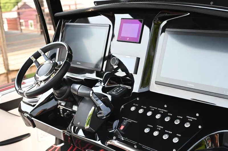 Slide: The Image of 2023 Sunsation 32 CCX dashboard with steering wheel and digital displays. - 22