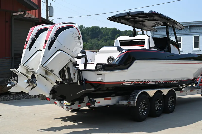 Slide: The Image of 2023 Sunsation 32 CCX boat on trailer with dual outboard engines. - 4
