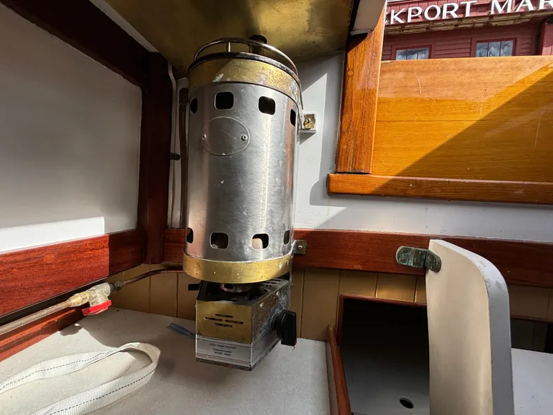 Slide: The Image of Vintage heater inside a 1951 Custom Pilot Cutter boat cabin. - 15