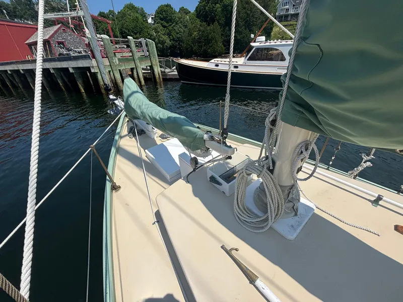 Slide: The Image of 1951 Custom Pilot Cutter docked, showcasing deck and rigging details. - 20