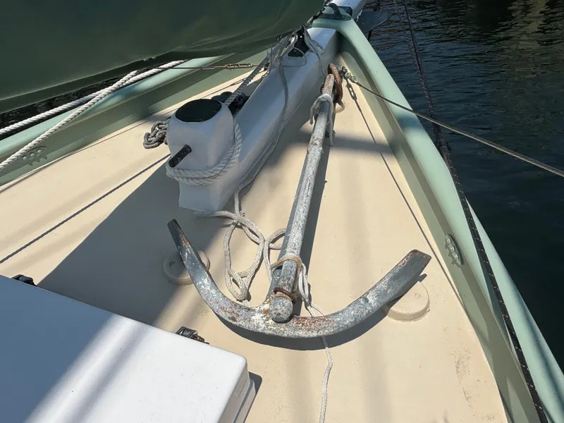 Slide: The Image of Vintage 1951 Custom Pilot Cutter deck with anchor and ropes. - 21