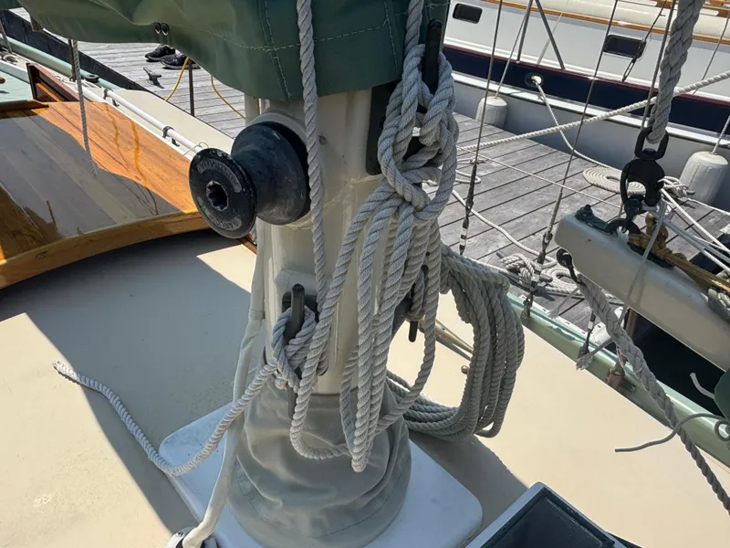 Slide: The Image of Ropes and fittings on a 1951 Custom Pilot Cutter sailboat deck. - 22