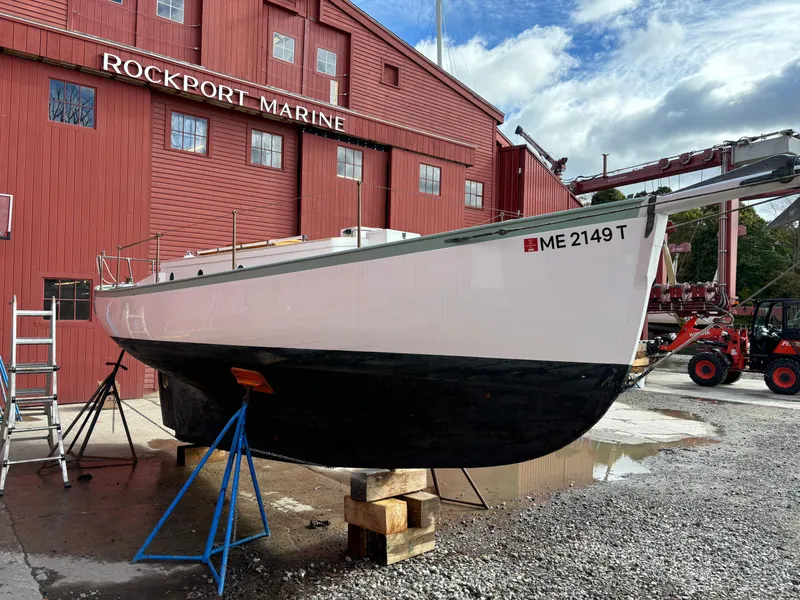 Slide: The Image of 1951 Custom Pilot Cutter at Rockport Marine, on stands for maintenance. - 29