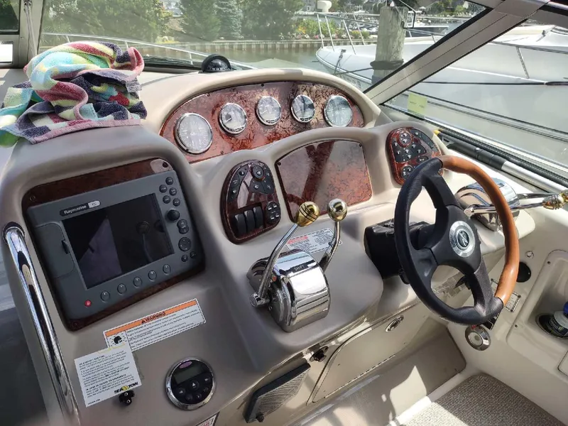 Slide: The Image of Luxurious interior of 2007 Sea Ray 340 Sundancer yacht with plush seating and helm. - 10