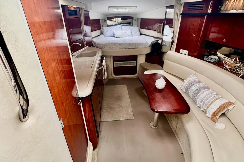 Slide: The Image of 2007 Sea Ray 340 Sundancer helm with dual white leather seats and steering wheel. - 15