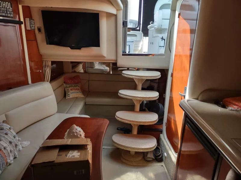 Slide: The Image of Luxurious interior of 2007 Sea Ray 340 Sundancer yacht with cozy seating and elegant wood finishes. - 17