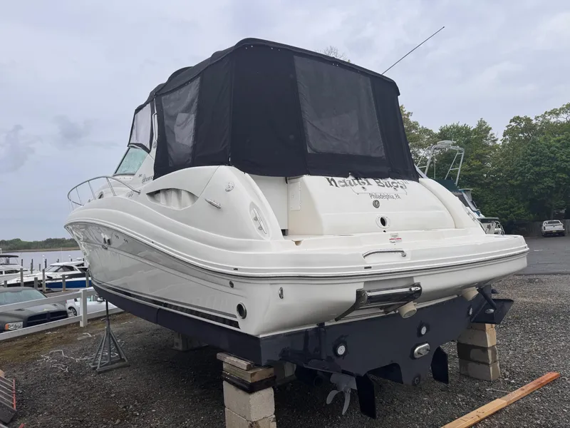 Slide: The Image of 2007 Sea Ray 340 Sundancer boat on calm water, overcast sky. - 3