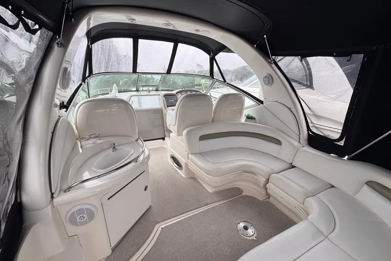 Slide: The Image of 2007 Sea Ray 340 Sundancer boat on calm water with overcast sky. - 5