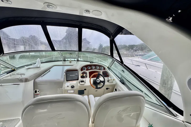 Slide: The Image of 2007 Sea Ray 340 Sundancer boat on trailer, displayed outdoors. - 8