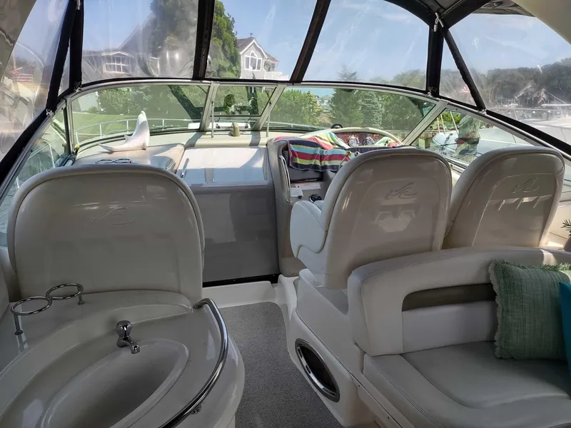 Slide: The Image of 2007 Sea Ray 340 Sundancer boat on trailer, parked outdoors. - 9