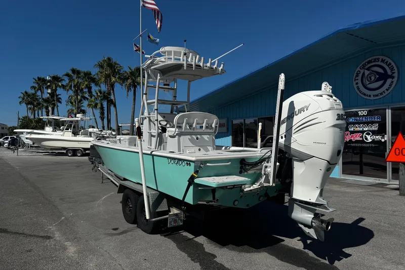 Slide: The Image of 2019 Dorado 25 Flat Deck boat on trailer, featuring a Mercury outboard motor. - 1