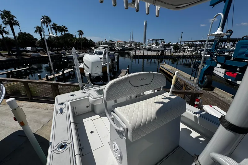 Slide: The Image of 2019 Dorado 25 Flat Deck boat at marina with palm trees and docks in background. - 22