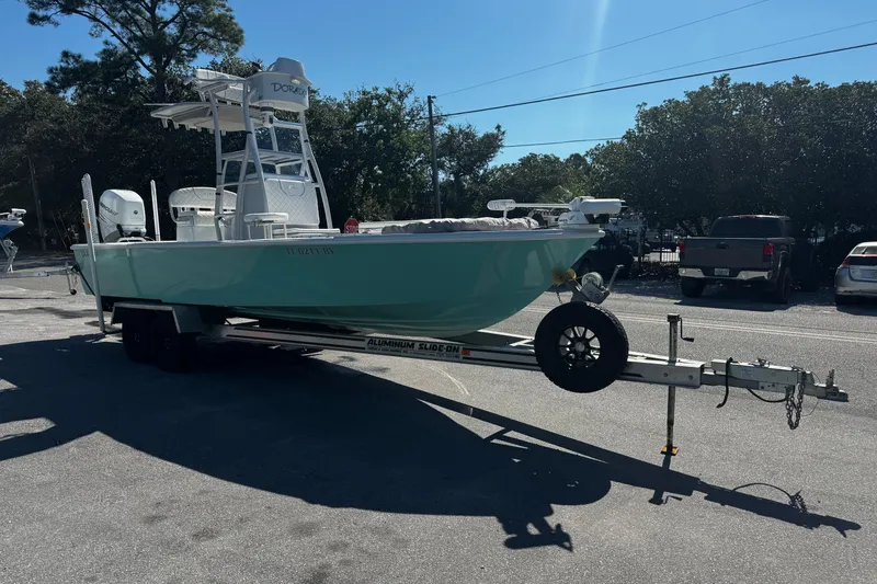 Slide: The Image of 2019 Dorado 25 Flat Deck boat on trailer in parking lot, sunny day. - 4