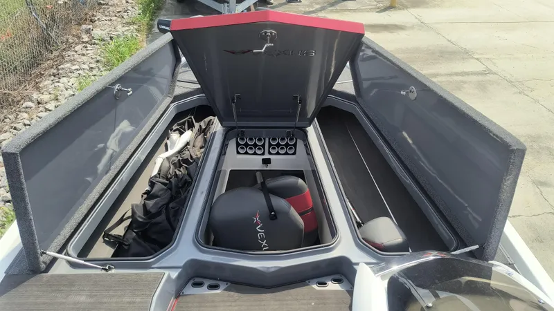 Slide: The Image of 2021 Vexus VX20 boat storage compartments open, showcasing organized interior layout. - 4
