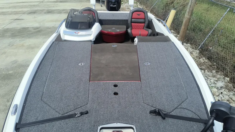Slide: The Image of 2021 Vexus VX20 boat interior with gray carpet and red seating. - 6