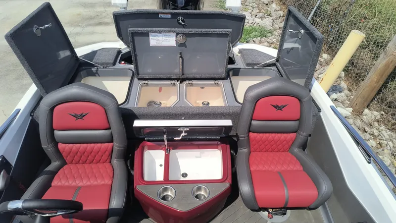 Slide: The Image of 2021 Vexus VX20 boat interior with red seats and open storage compartments. - 8