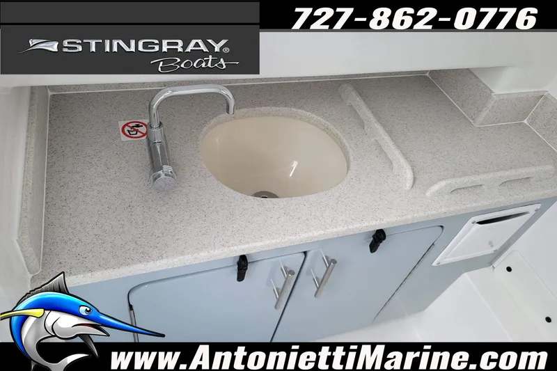 Slide: The Image of 2026 Stingray 253 CC boat sink and countertop, featuring sleek design and modern fixtures. - 22