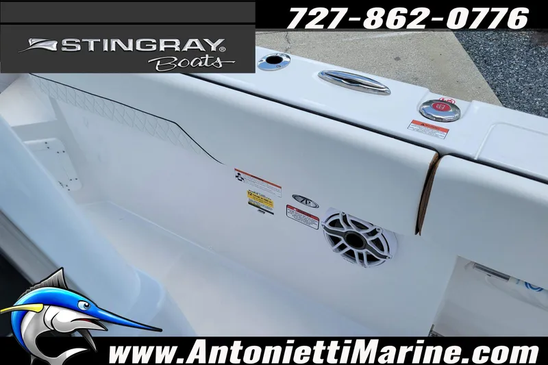 Slide: The Image of 2026 Stingray 253 CC boat interior with speaker and branding details. - 27
