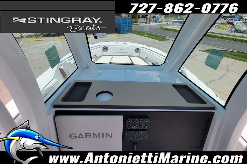 Slide: The Image of Interior view of 2026 Stingray 253 CC boat with Garmin navigation system. - 30