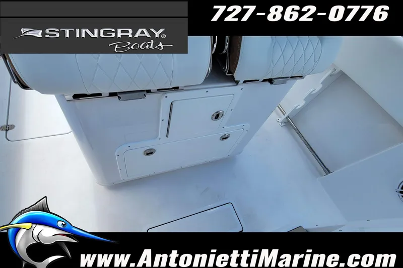 Slide: The Image of 2026 Stingray 253 CC boat interior with seating and storage compartments. - 36