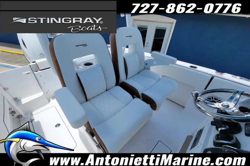 Slide: The Image of 2026 Stingray 253 CC boat interior with plush seating and steering wheel, featuring Antonietti Marine branding. - 37