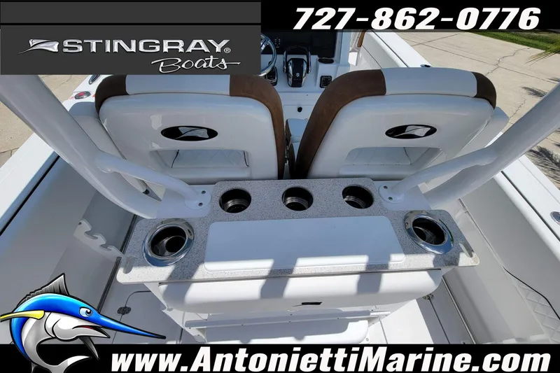 Slide: The Image of 2026 Stingray 253 CC boat interior with cup holders and seating, featuring Antonietti Marine branding. - 39