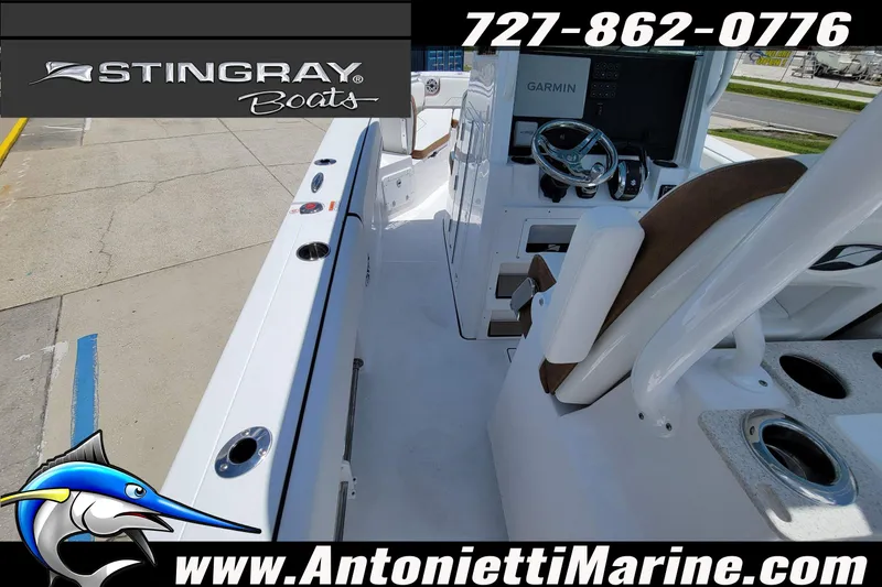 Slide: The Image of 2026 Stingray 253 CC boat interior with Garmin navigation, showcased by Antonietti Marine. - 40
