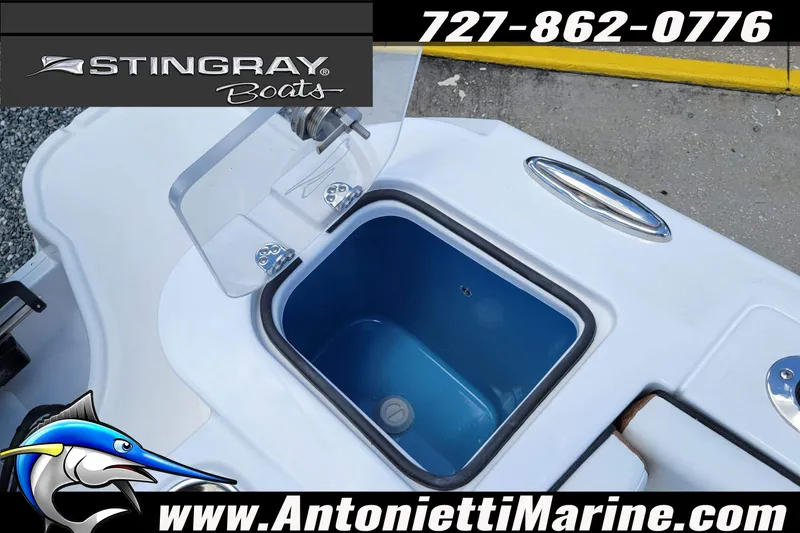Slide: The Image of Stingray 253 CC 2026 boat with open storage compartment, Antonietti Marine branding. - 48