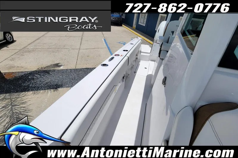 Slide: The Image of 2026 Stingray 253 CC boat interior at Antonietti Marine dealership. - 6