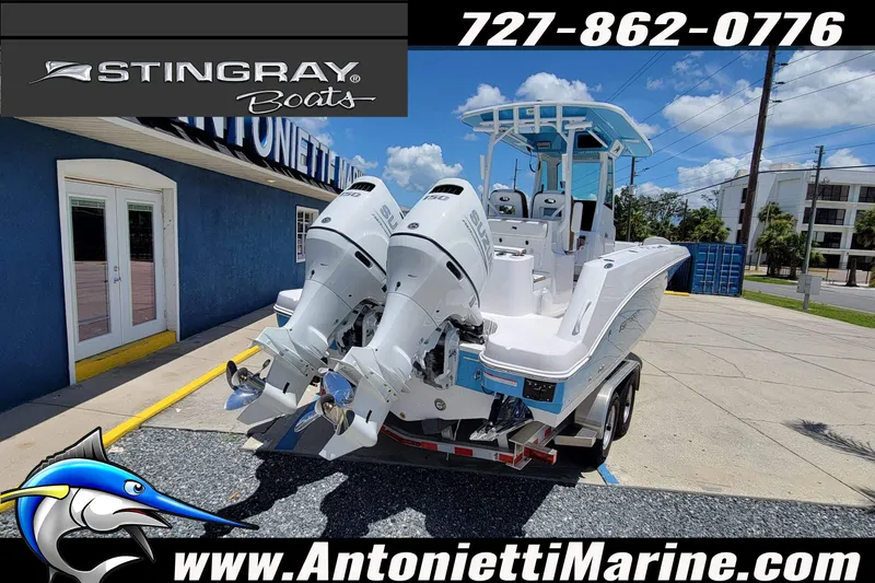 Slide: The Image of 2026 Stingray 253 CC boat with dual engines at Antonietti Marine dealership. - 61
