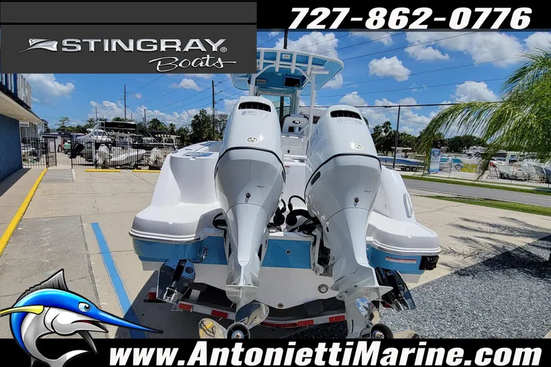 Slide: The Image of 2026 Stingray 253 CC boat with dual engines at Antonietti Marine dealership. - 62
