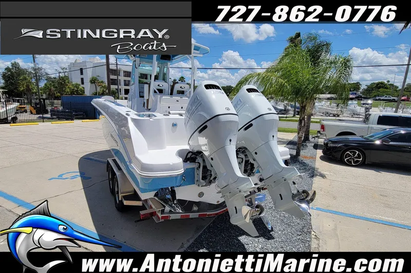 Slide: The Image of 2026 Stingray 253 CC boat with dual engines at Antonietti Marine dealership. - 63