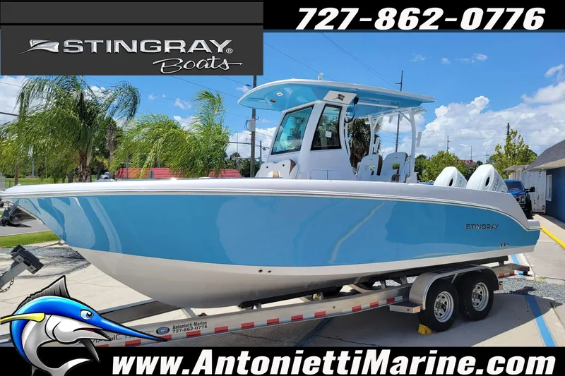 Slide: The Image of 2026 Stingray 253 CC boat in blue on trailer, displayed at Antonietti Marine. - 65