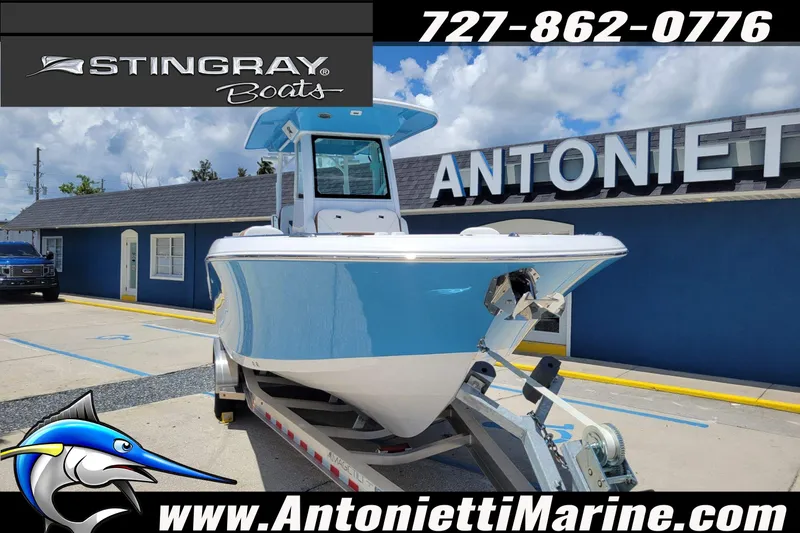Slide: The Image of 2026 Stingray 253 CC boat on trailer at Antonietti Marine dealership. - 66