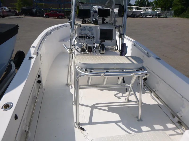 Slide: The Image of 2003 Sea Pro 220 Center Console boat interior with steering wheel and seating. - 5