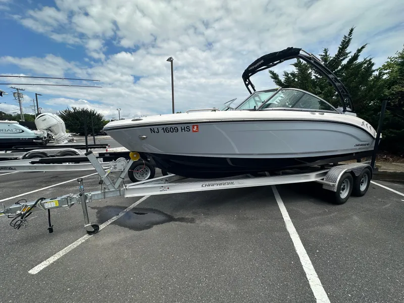 Slide: The Image of 2023 Chaparral 21 SSi OB boat on trailer in parking lot. - 2