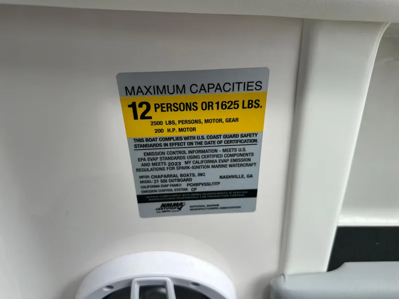 Slide: The Image of 2023 Chaparral 21 SSi OB capacity label: 12 persons or 1625 lbs, 200 HP motor. - 22