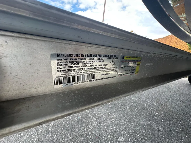 Slide: The Image of 2023 Chaparral 21 SSi OB trailer label detailing specifications and manufacturing information. - 29