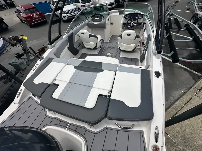 Slide: The Image of 2023 Chaparral 21 SSi OB boat interior with seating and dashboard view. - 5