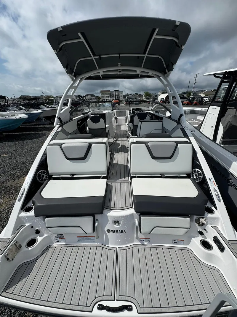 Slide: The Image of 2023 Yamaha Boats 252SD with sleek seating and modern design. - 10