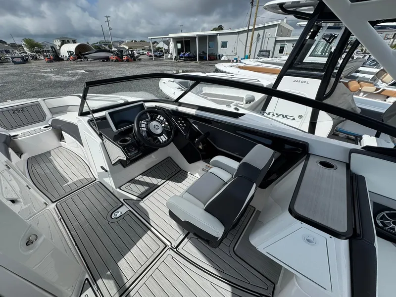 Slide: The Image of 2023 Yamaha Boats 252SD cockpit with modern controls and sleek design. - 18