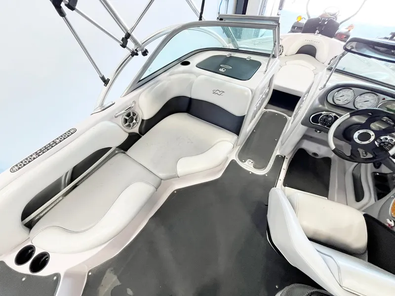 Slide: The Image of 2005 Nautique Air Nautique SV-211 boat interior with seating and dashboard view. - 10