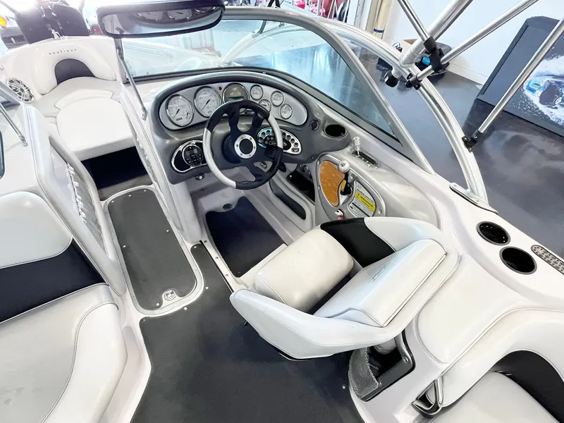 Slide: The Image of 2005 Nautique Air Nautique SV-211 boat interior with steering wheel and dashboard controls. - 11