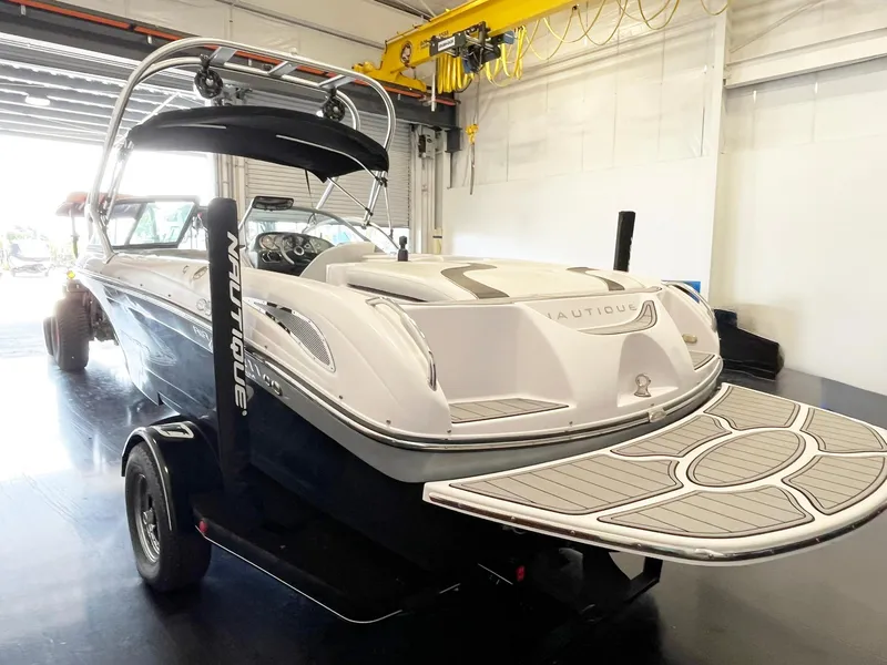 Slide: The Image of 2005 Nautique Air Nautique SV-211 boat in garage, rear view with trailer. - 6