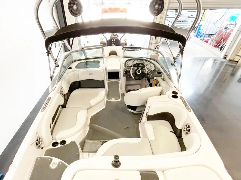 Slide: The Image of 2005 Nautique Air Nautique SV-211 boat interior with seating and steering wheel. - 7